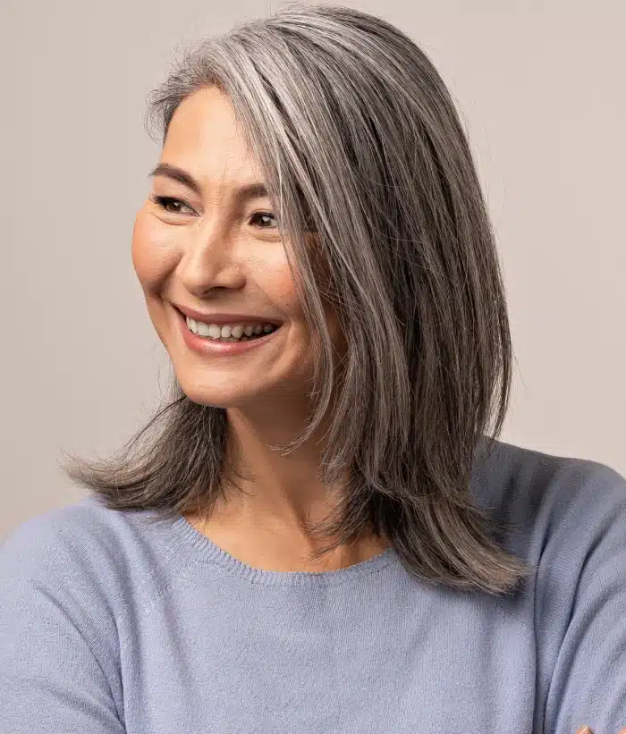 woman smiling confident after dental implants 1